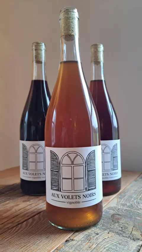 Aux Volets Noirs wine bottles