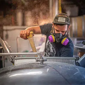 A brewer at work on the Backroads brewhouse