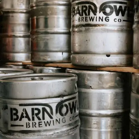 Stacked Barn Owl Brewing kegs