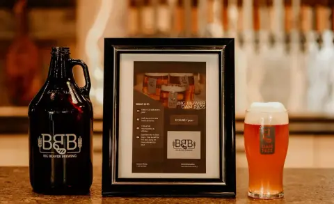 Big Beaver growler and a pint of amber beer