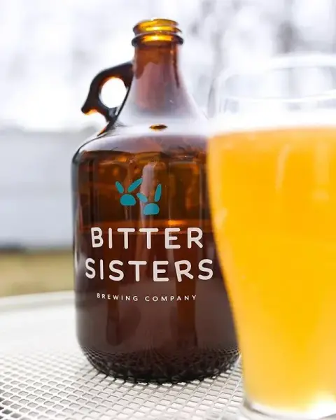 A growler of Bitter Sisters beer