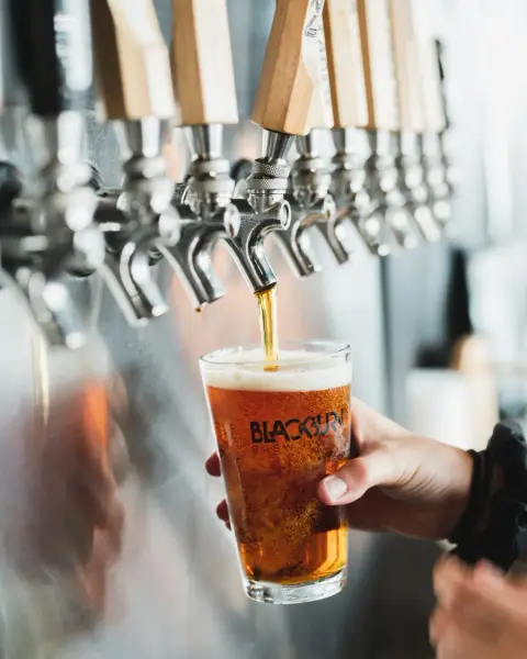 A Blackburn pint being poured from the taps