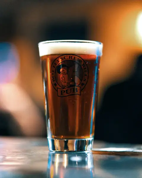 A pint of amber beer in a Bottlescrew Bill's Pub glass