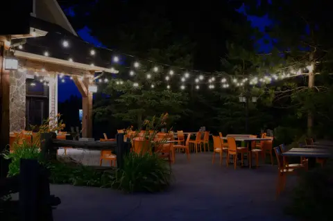 The Anorak brewpub terrace in Morin-Heights, lit at night