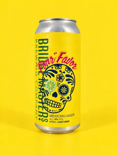 A can of Bridge Masters "Pour" Favor Mexican Lager