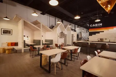 Cabin Brewing Company taproom with cabin-style booths