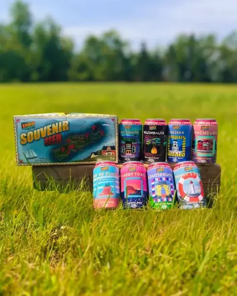 Candid Brewing's Nova Scotia Souvenir Beer 8-pack and cans on the grass