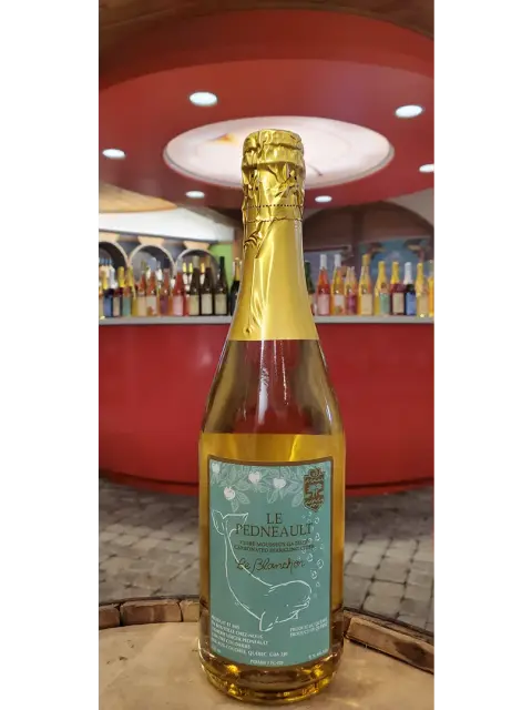 A bottle of Pedneault Le Blanchon, a light sparkling cider