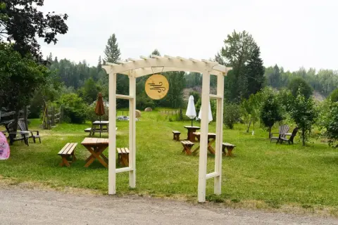 Picnic tables on the lawn at the Cold Front farm cidery