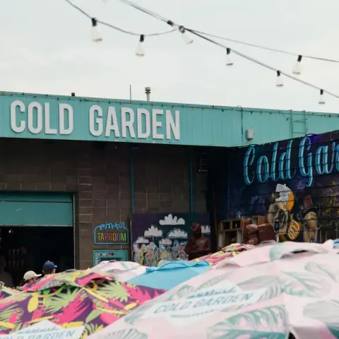 Cold Garden brewery exterior with colourful umbrellas and string lights