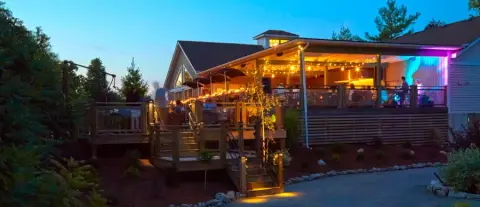 The Creekside Estate Winery deck lit up in the evening