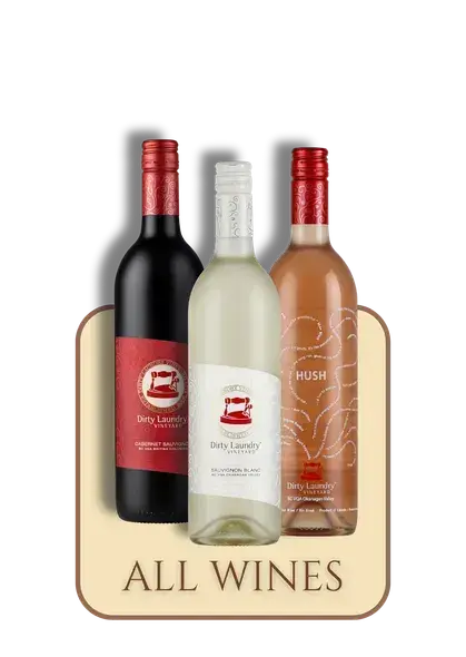 Three bottles of wine are sitting next to each other on a table.