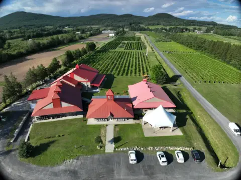 Aerial view of the Domaine de Lavoie buildings and vineyard in Rougemont