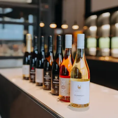 Domaine St-Jacques bottles lined up on the tasting counter