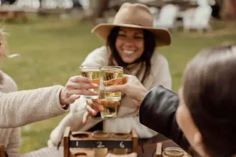 people enjoying cider