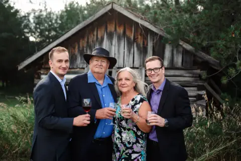 The Fuhr Estate team holding a bottle