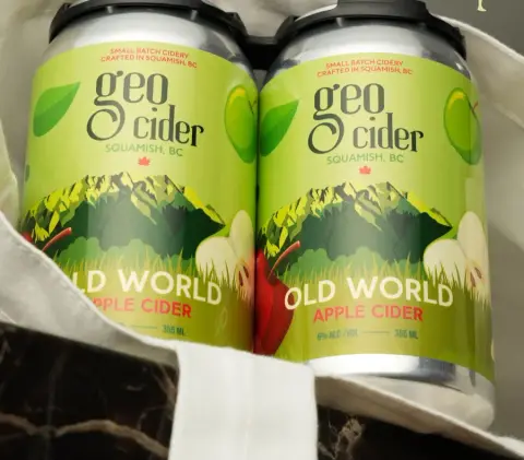Two cans of Geo Cider Old World apple cider