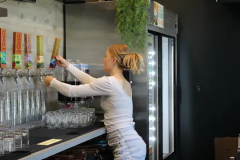 Pouring cider from the taps in the Geo Cider tasting room