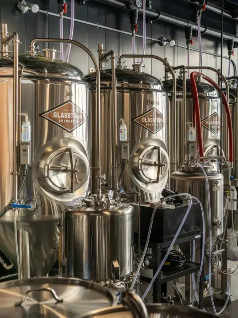 Glasstown-branded fermenters in the Wallaceburg brewhouse