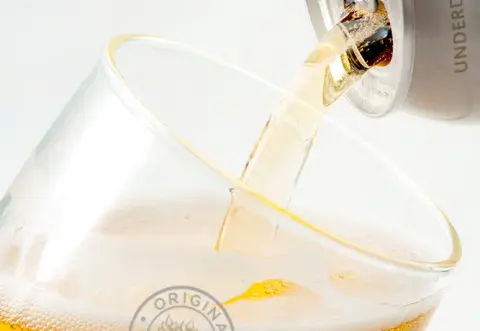 Original 16 beer poured from a can