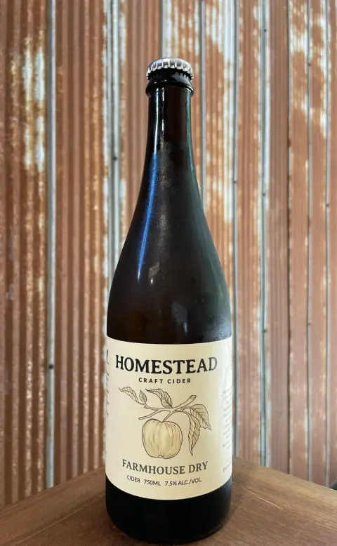 A 750ml bottle of Homestead Farmhouse Dry cider