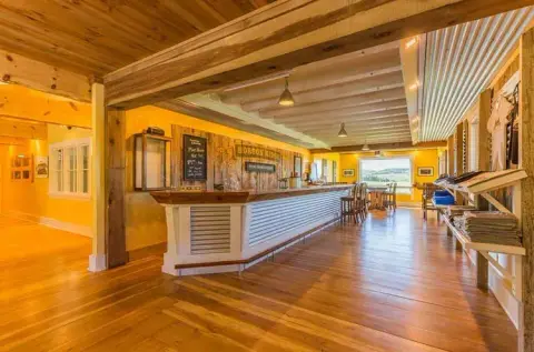 The Horton Ridge taproom bar with wood floors and beams