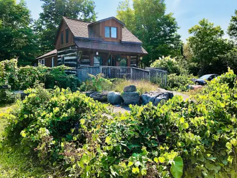The log cabin that houses the Kawartha Country Wines winery near Buckhorn, in summer