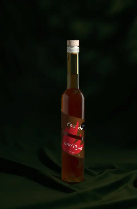 A bottle of Feu de barrique, a barrel-fermented fire cider