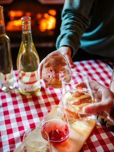 Labonté de la pomme ciders poured into tasting glasses on a checked tablecloth