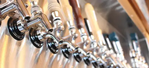 Row of beer taps at the Le Naufrageur pub