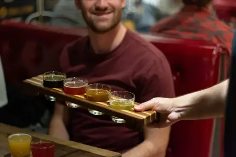 Tasting flight of Le Trèfle Noir beers at the pub