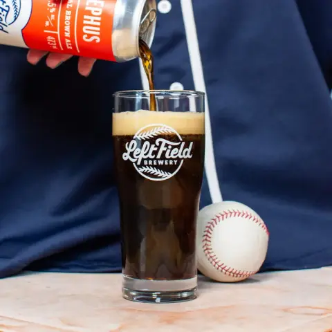 Left Field Eephus oatmeal brown ale poured from a tall can
