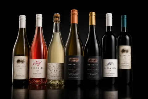 Seven bottles from the Meldville wine collection, including white, rosé, sparkling and red wines