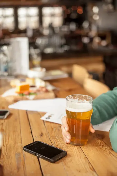 A glass of West Shefford beer on the taproom table