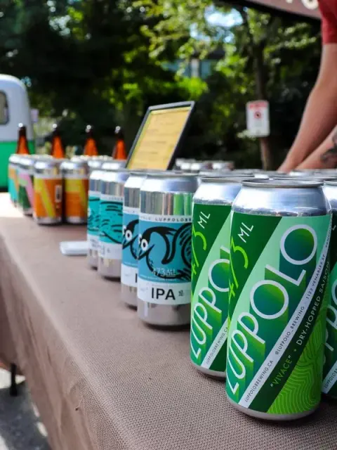 A row of Luppolo craft beer cans