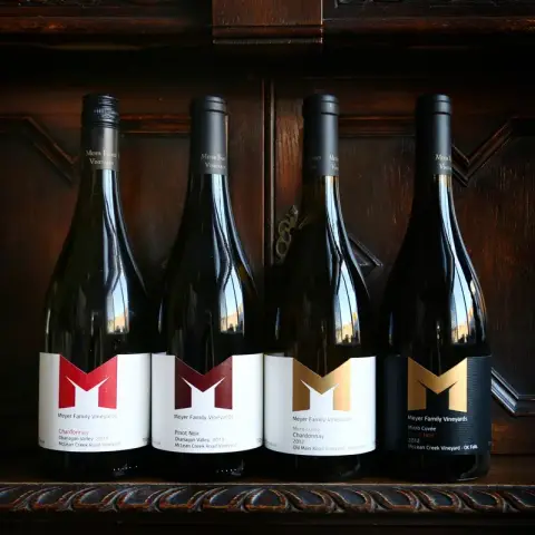 Row of Meyer Pinot Noir and Chardonnay bottles