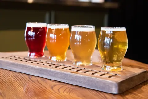 A tasting paddle of four Locomotiv beers