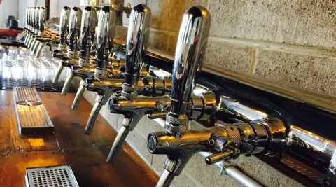 The row of draft taps at Midtown Brewing Company in Wellington