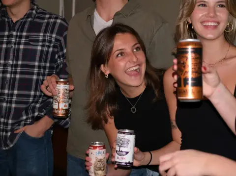 Young adults enjoying Bulwark cider at taproom