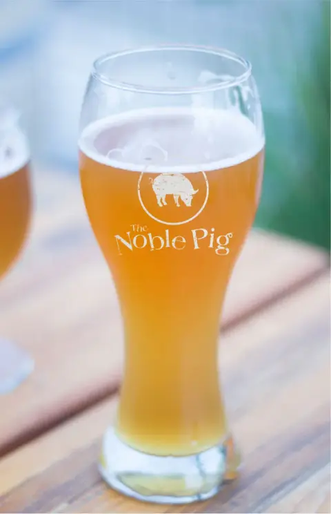 A glass of Noble Pig house beer