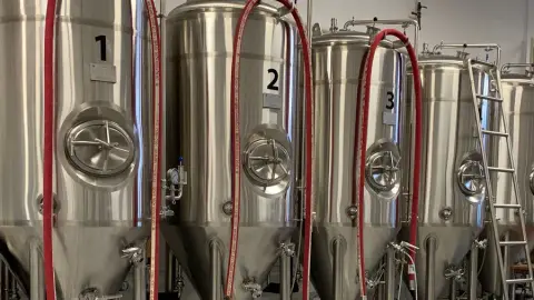 Stainless fermenting tanks in the Omen Brewing brewhouse