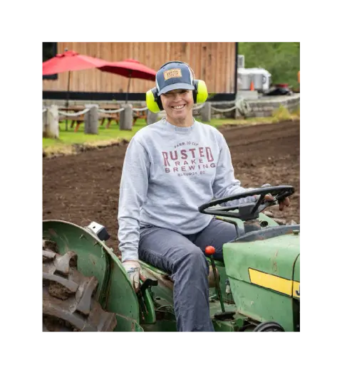 Working the Rusted Rake farm in Nanoose Bay by tractor