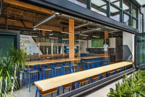 Shaketown taproom with communal tables and open windows