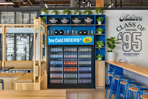 Cans of Shaketown beer in the taproom fridge