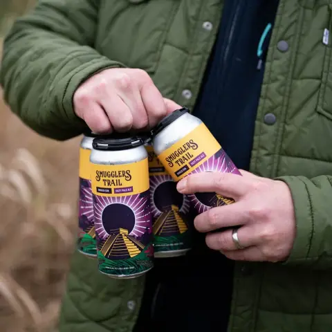 A four-pack of Smugglers Trail cans