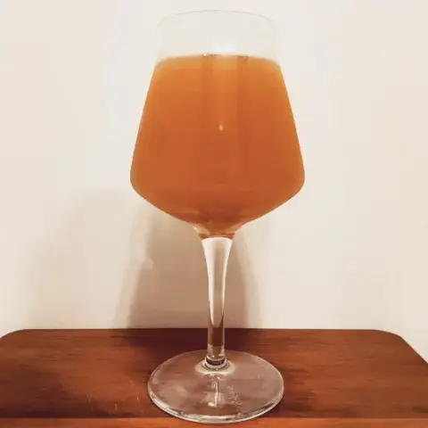 A glass of Osmotar Sahti, Stonyslope's signature beer