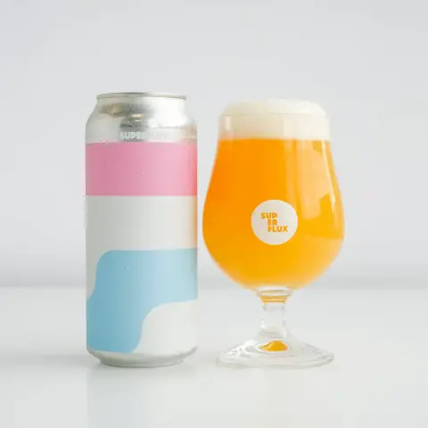 A can of Superflux Colour & Shape IPA beside a poured glass