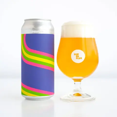 A can of Superflux Happyness IPA beside a poured glass