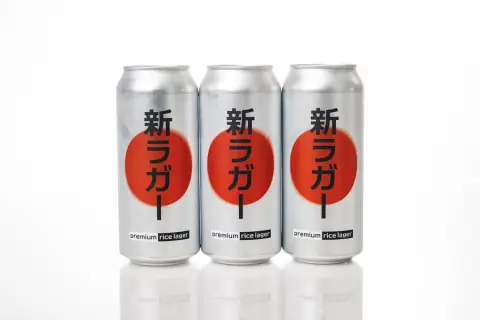Three cans of Superflux premium rice lager