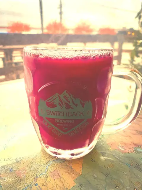 A Switchback Brewing mug of red sour beer